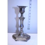 A hallmarked silver loaded candlestick