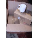 A box of 6x6 bone china stacking mugs