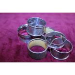 Five assorted silver napkin rings (all hallmarked)