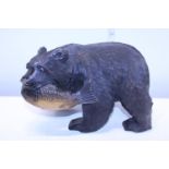 A hand carved wooden Black Forest style bear figure