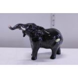 A black elephant Beswick figurine