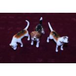 Three Beswick dog figurines