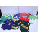 A job lot of assorted adult size cricket shirts
