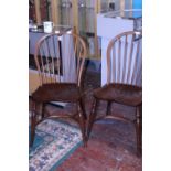 A pair of John Harrison spindle back chairs (slight damage to one of the stretchers), shipping