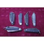 Six assorted military pocket knives some dated for WW2