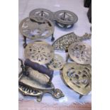 A good selection of assorted brass trivets
