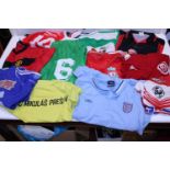 A job lot of assorted football shirts