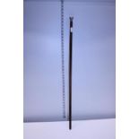 A antique walking cane with a hallmarked silver top. Shipping unavailable