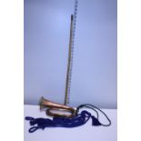 A military bugle with lanyards and a West Riding Regiment swagger stick. Shipping unavailable