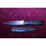 A vintage sheathed serrated edge knife by William Rodgers of Sheffield