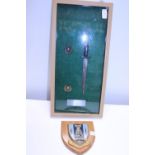 A cased Fairbairn Sykes Commando knife along with Royal Marine cap badges and a 40 Commando plaque