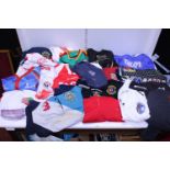 A large job lot of assorted sports shirts