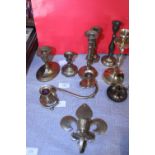 A selection of assorted brass candle sticks etc
