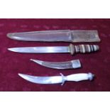 Two Oriental sheath knifes in scabbards
