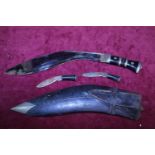 A vintage Kukri knife with scabbard and two smaller knifes a/f
