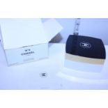 A boxed Chanel no5 loose power compact