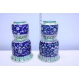 A pair of Chinese bell shaped porcelain vases, finely decorated with scrolling design