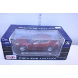 A boxed Maisto Porche model