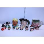 A job lot of assorted Toby and Character jugs including Beswick and Royal Doulton examples