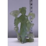 A hand carved jadeite figurine (slight damage to base)