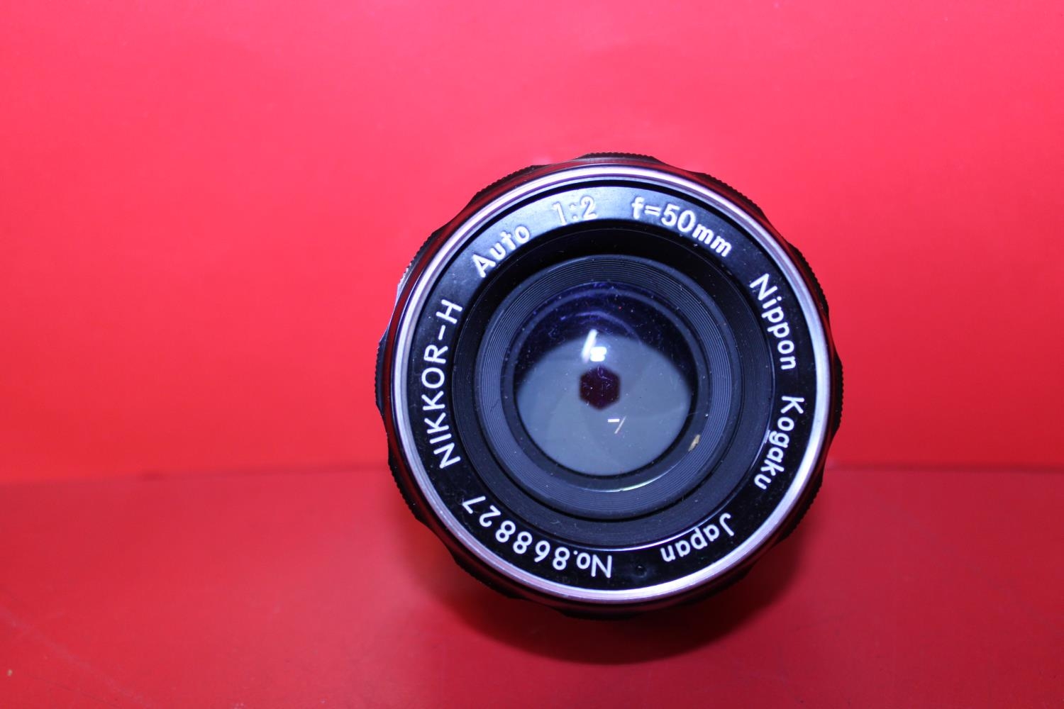 A Nikkor-H auto 1..2 F=50mm camera lens