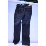 A pair of RST oversized jeans W32 with pads