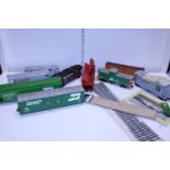 A selection of O gauge wagons and accessories