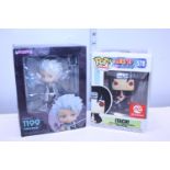 A boxed POP! figure and one other
