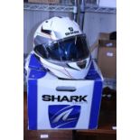A boxed Shark crash helmet