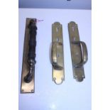A pair of Victorian brass door handles and one other