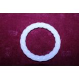 A Chinese White Jade bracelet finely carved with twist design