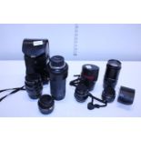 A job lot of assorted camera lenses including Tamron and Yashica