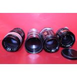 Four assorted camera lenses