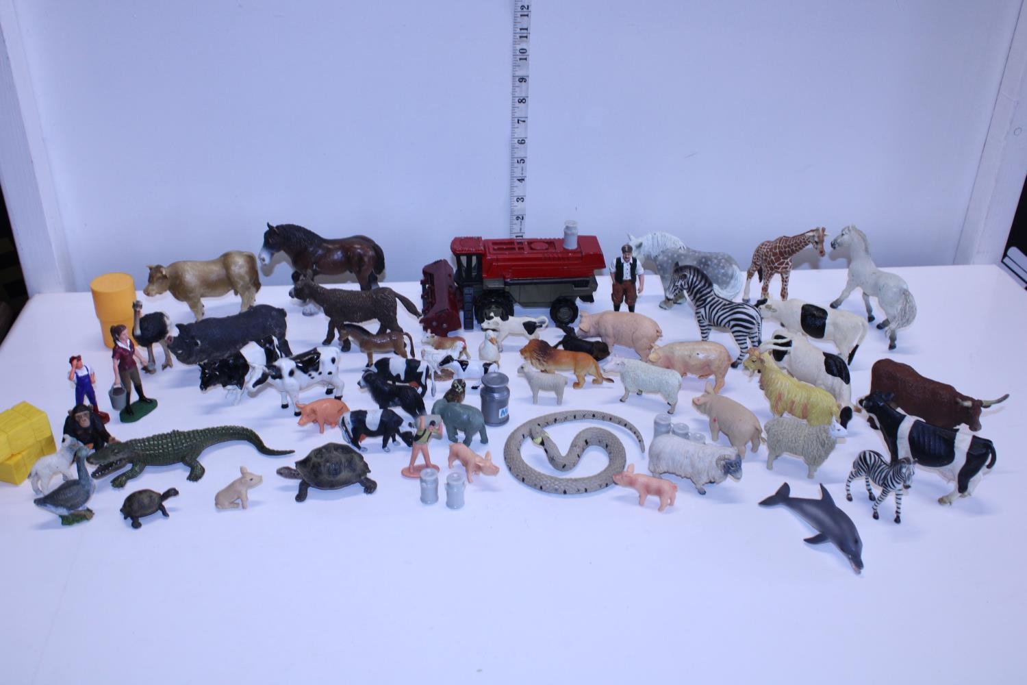 A box of assorted ELC farm animals including Schleich and Papo