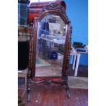 A large mahogany antique chevalier mirror (with replacement glass, slight damage to freeze)