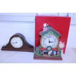 A boxed novelty Christmas clock and a vintage style mantle clock