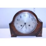 A 1930's wooden cased mantle clock in working order