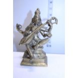 A Oriental heavy gilt brass deity figure