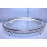A good quality silver plaed galleried tray on four legs