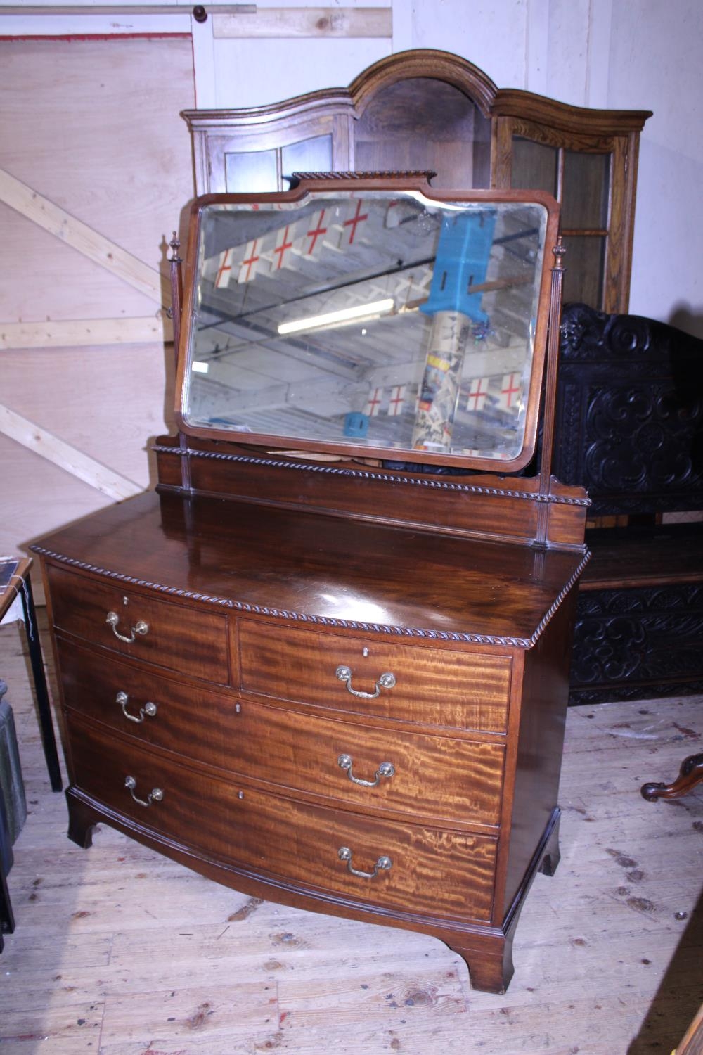 A quality vintage mahogany bow fronted two over two drawer dressing table with swivel mirror, approx