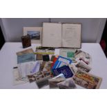A selection of vintage ephemera including cigarette cards, maps, postcards etc