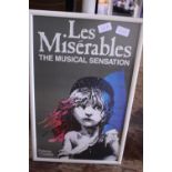 A framed Les Miserables poster