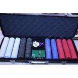 A cased poker set. Postage unavailable