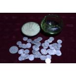 A glass pot full of Victorian & Edwardian three pence pieces