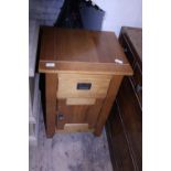 A exotic wooden bedside cabinet with drawer and cupboard, shipping unavailable