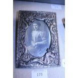 A cast white metal photo frame