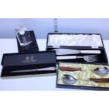 A selection of boxed cutlery and other items