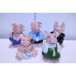 A set of five vintage NatWest ceramic pigs by Wade