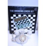 A boxed novelty drinking chess set game and a vintage style telephone
