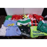 A box of assorted football shirts